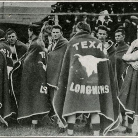 Texas Longhorns fans using the Hook 'em Horns gesture